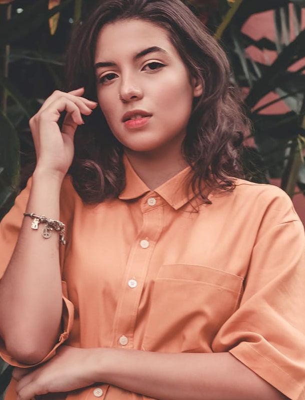 A girl in orange shirt portrait